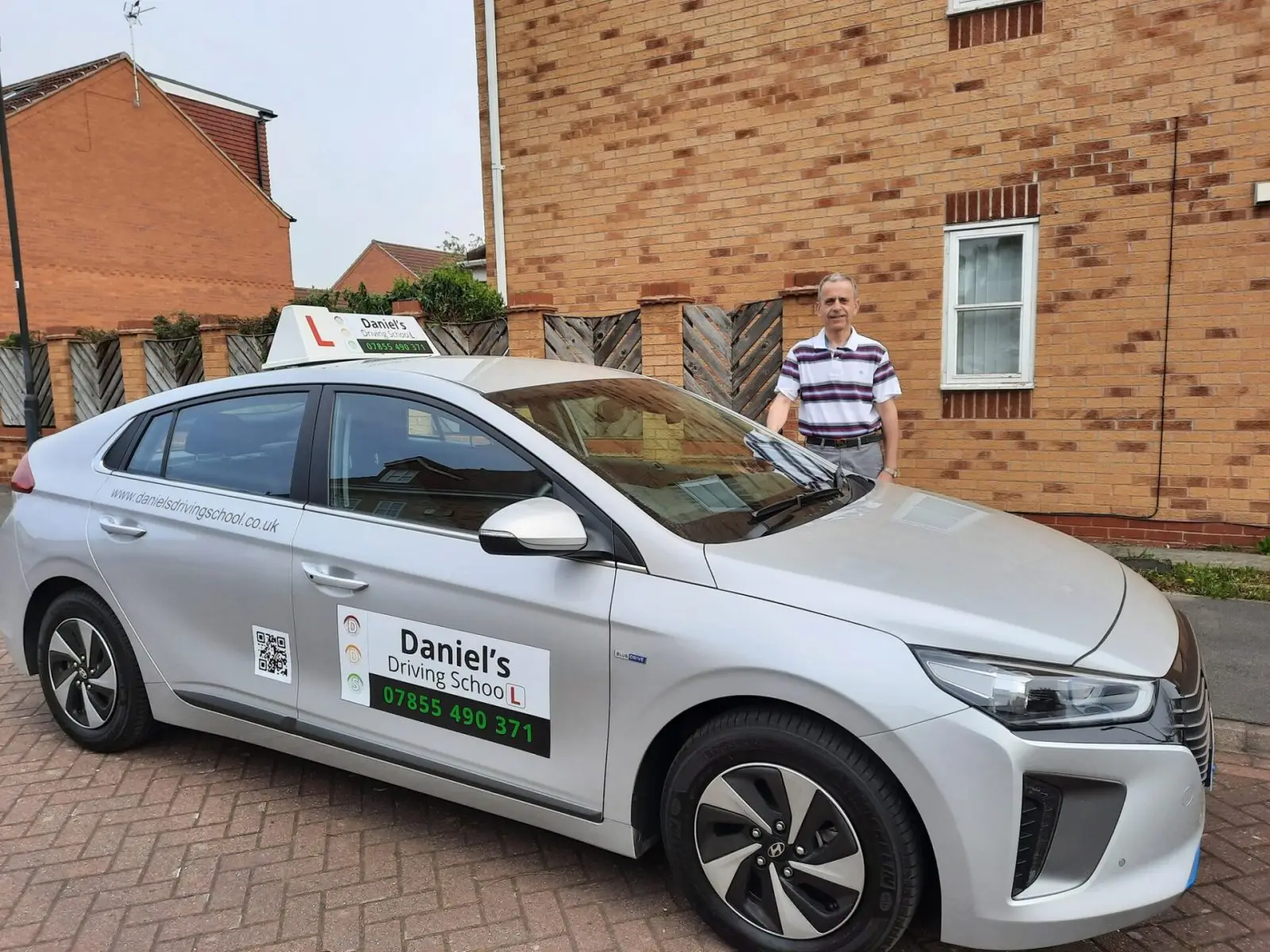 Daniel with his dual-controlled tuition car, Daniel's Driving School York
